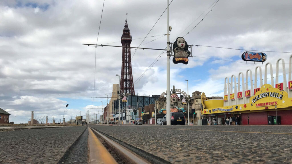 Vibrant Blackpool Tower View with Amusements | Stunning Wallpaper