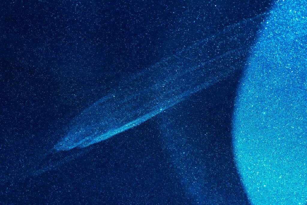Abstract Blue Wallpaper: Glittering Cosmic Scene for Digital Devices