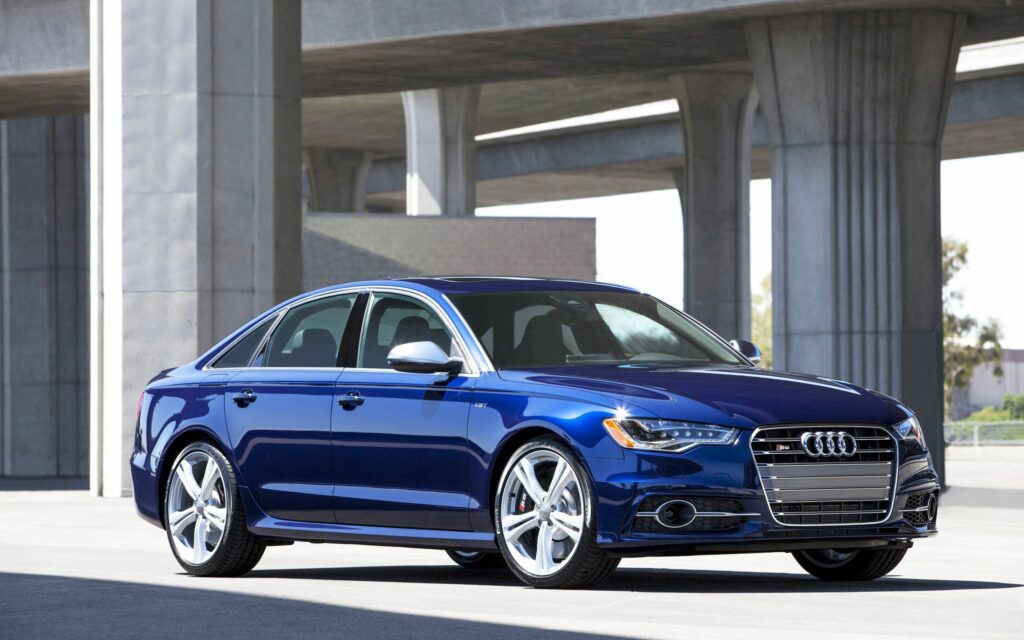 Stunning Blue Audi Car with Modern Architecture Wallpaper