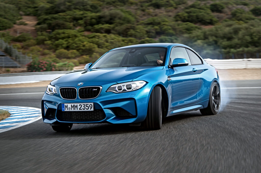 Stunning Blue BMW M2 F87 Wallpaper: Sleek Racetrack View