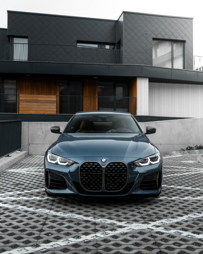 Stunning Blue BMW M3: Front View Urban Luxury Wallpaper