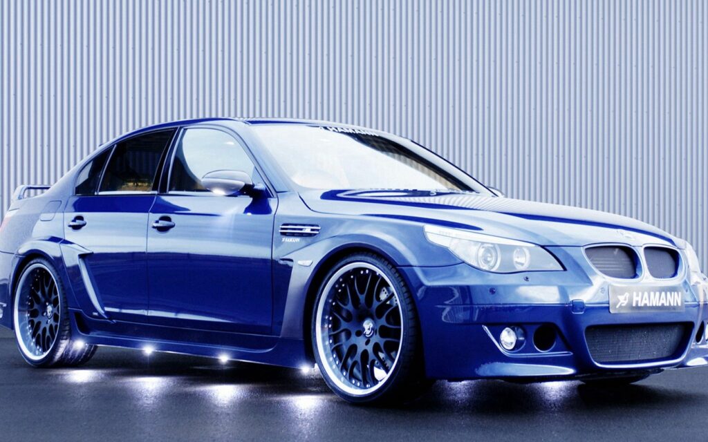 Striking Blue BMW with Custom Wheels & Sleek Design Background Wallpaper