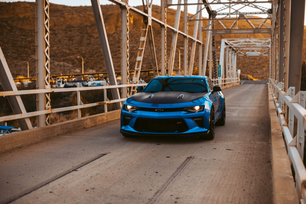 Stunning Blue Camaro Wallpaper: Rustic Bridge & Golden Hills Backdrop