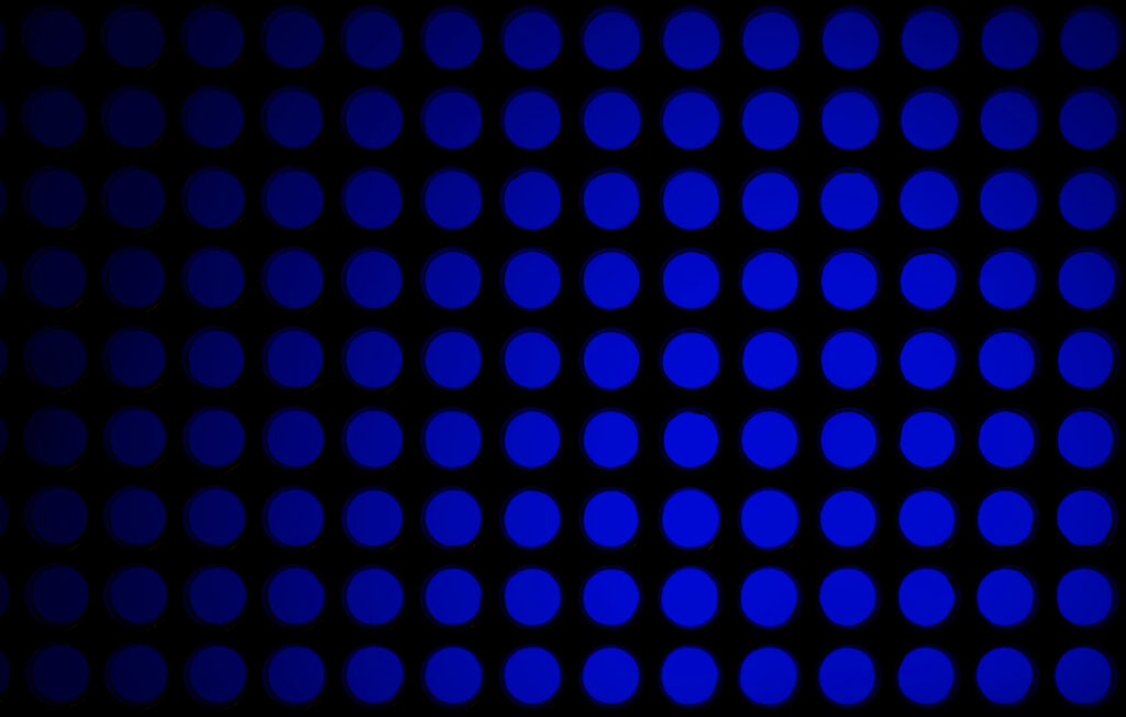 Abstract Blue Circle Pattern Wallpaper on Black Background