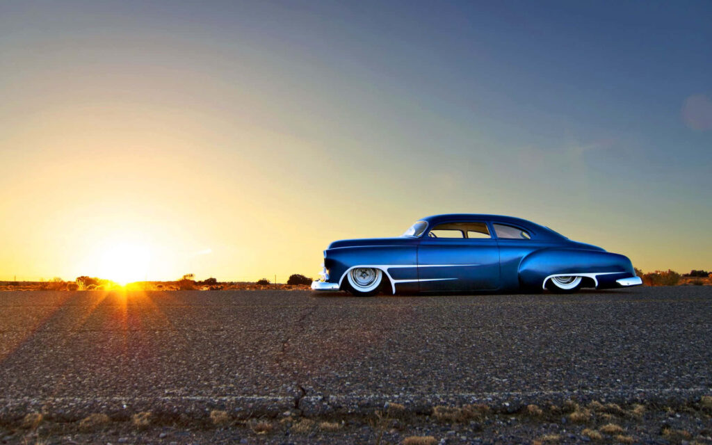 Stunning Blue Hot Rod Wallpaper Against Beautiful Sunset Background