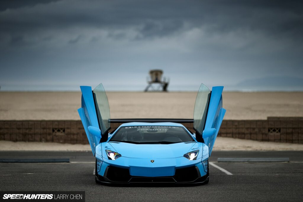 Blue Lamborghini Aventador: Dramatic Beach Background Wallpaper