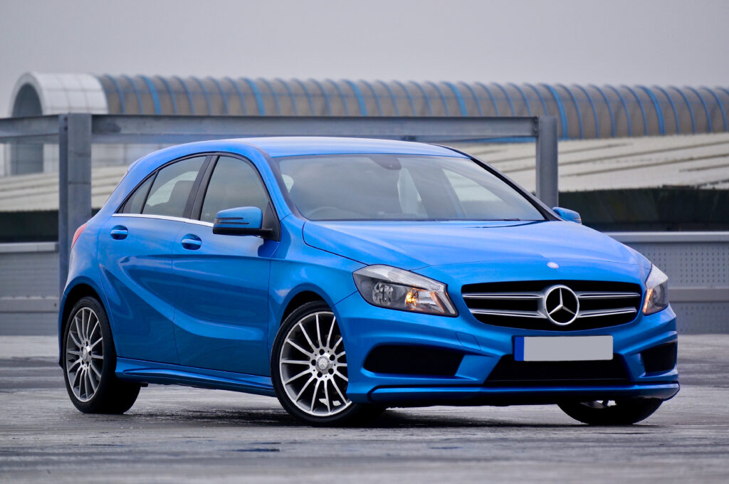 Stylish Blue Mercedes-Benz Wallpaper: Sleek Design & Urban Background
