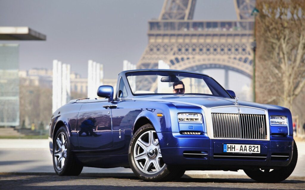 Elegant Blue Rolls-Royce Phantom Convertible Wallpaper with Urban Background