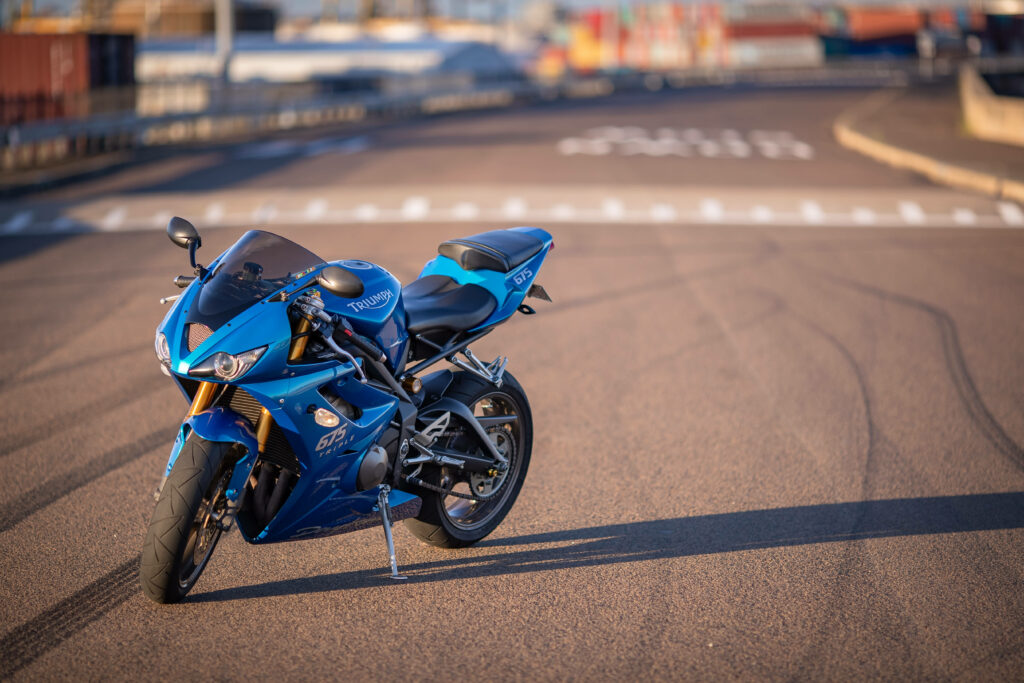 Stunning Blue Triumph Motorcycle Wallpaper on Open Road