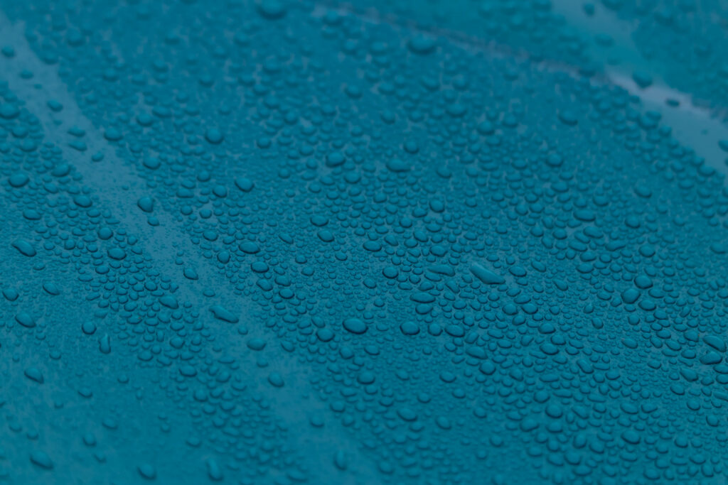 Vibrant Blue Water Droplets Macro - Textured Wallpaper Background