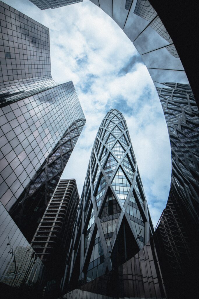 Stunning Bottom-Up View of Modern Glass Architecture Wallpaper