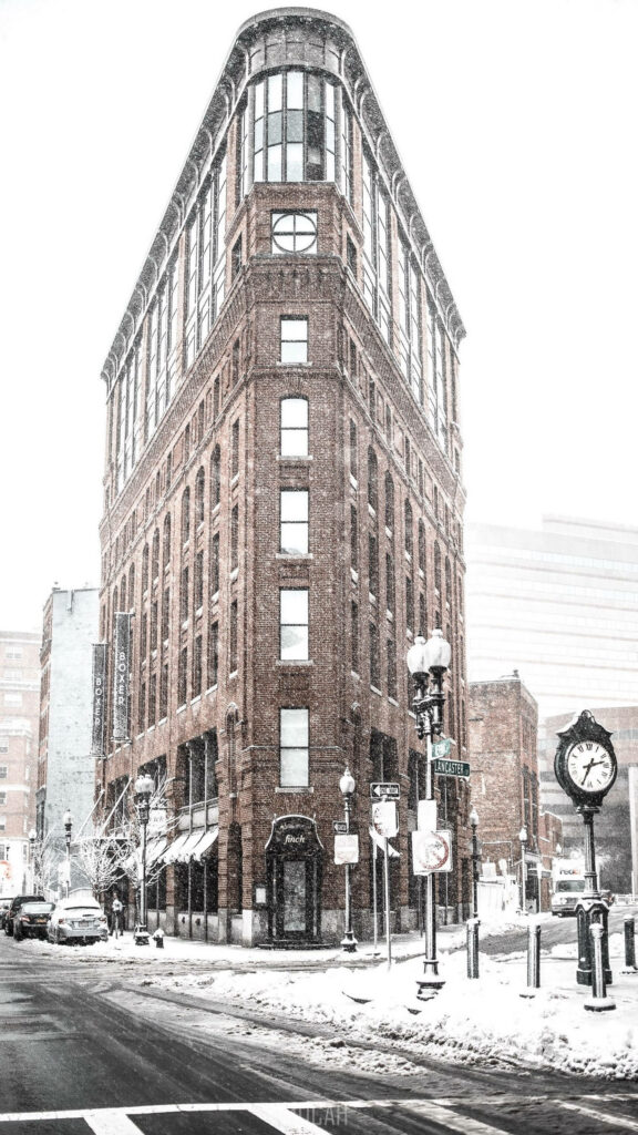 Elegant Snowy Triangular Brick Building Wallpaper Background