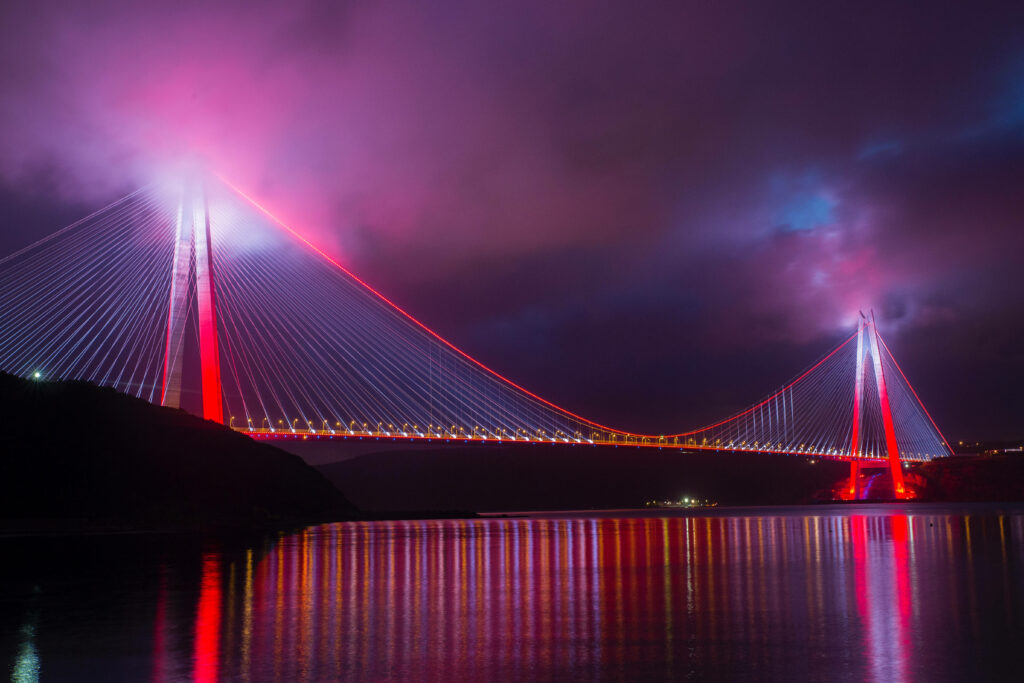 Stunning Illuminated Bridge Wallpaper: Night Sky Background Art