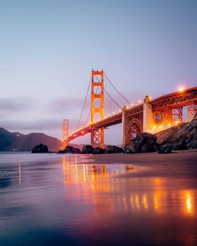 Serene Bridge at Night: Illuminated Wallpaper Background