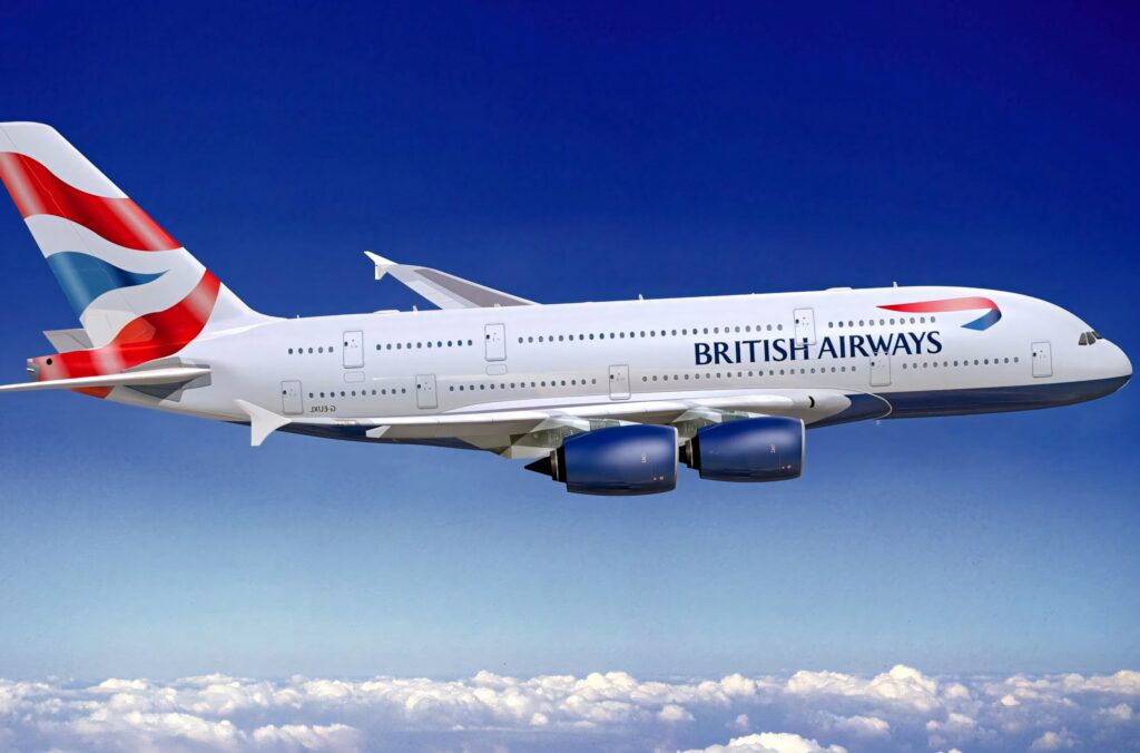 British Airways airplane flying above white clouds under clear blue sky modern aviation wallpaper