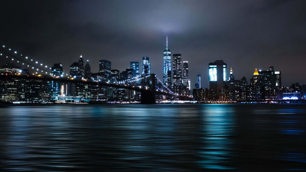 Nighttime Brooklyn Bridge Wallpaper with NYC Skyline Reflection