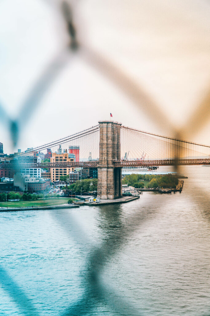 Brooklyn Bridge Wallpaper: Stunning View Through a Wire Fence
