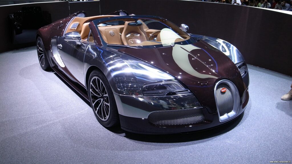 Elegant Bugatti Veyron Wallpaper: Luxury Sports Car in Showroom Lights