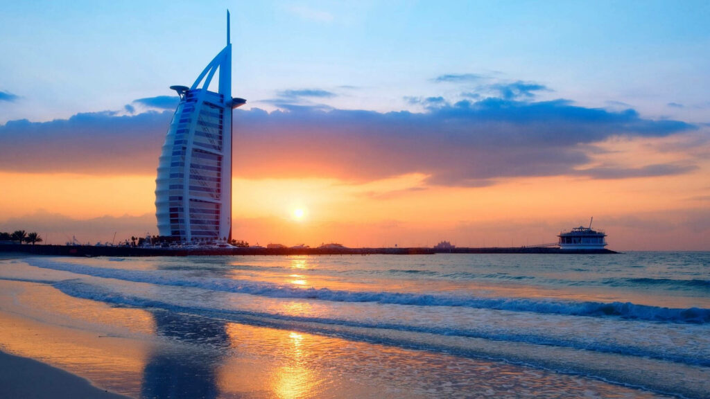 Stunning Burj Al Arab Sunset Wallpaper: Vibrant Sky & Serene Beach