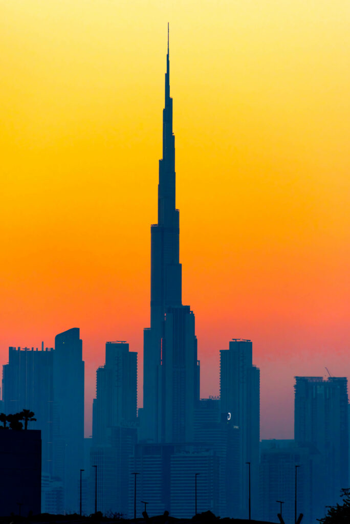 Vibrant Sunset Wallpaper: Burj Khalifa Silhouette & Dubai Skyline