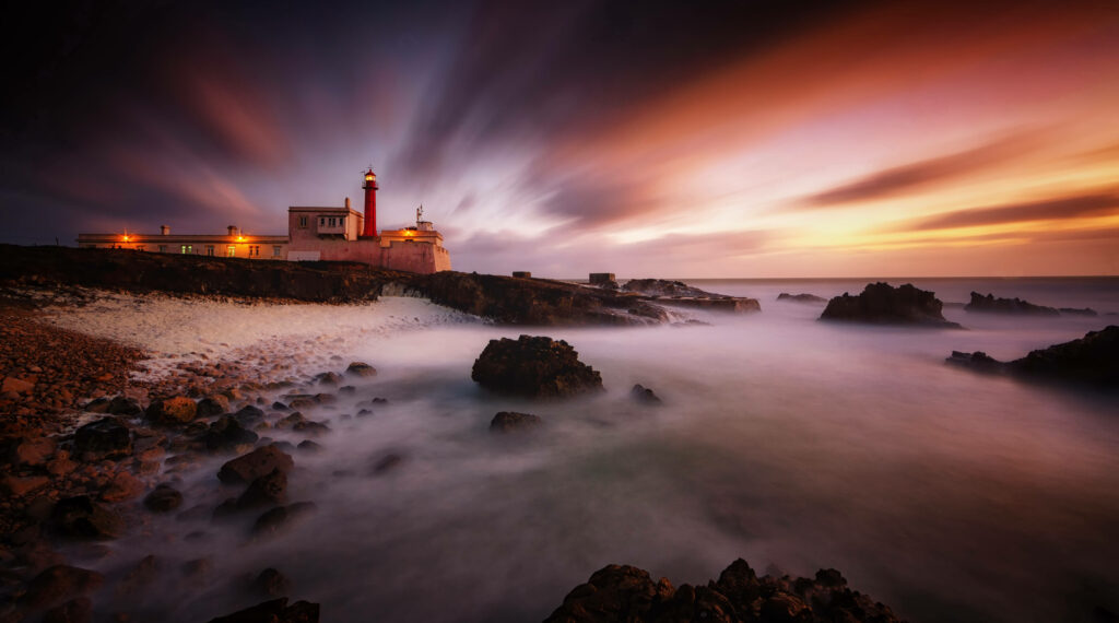 Stunning Cabo Raso Lighthouse Sunset Wallpaper - Vibrant Coastal Scene