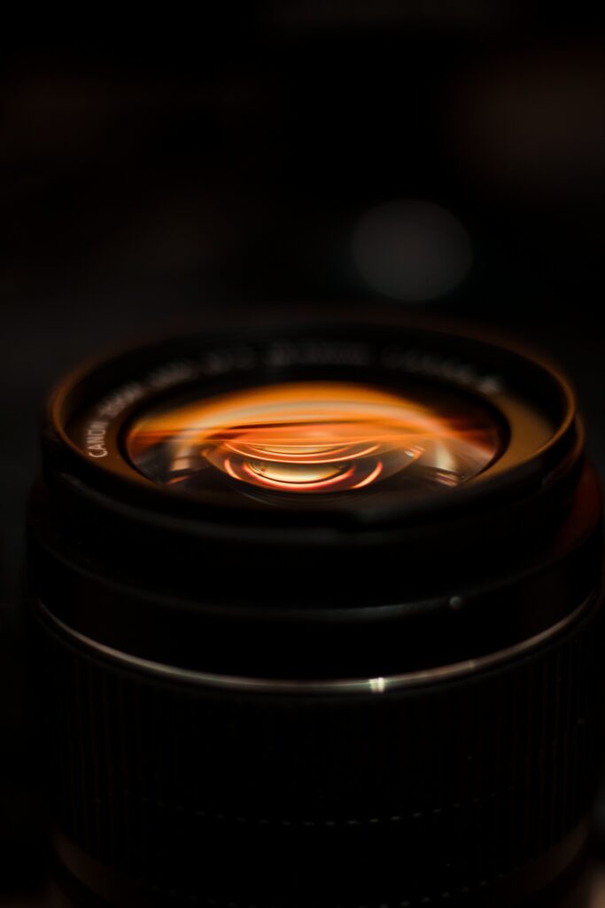 Moody Camera Lens Close-Up: Intricate Details & Light Reflection Wallpaper