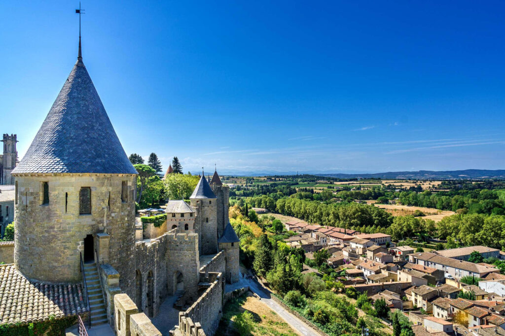 Chateau Comtal Wallpaper: Medieval Architecture in Scenic Carcassonne