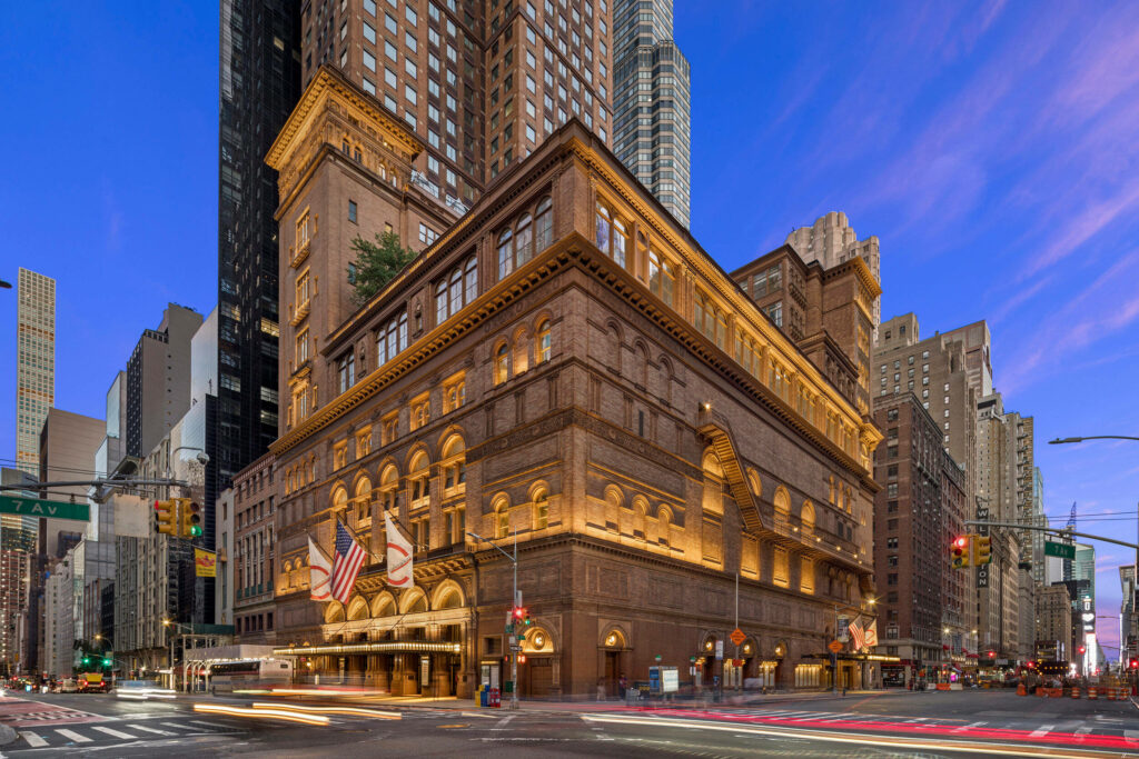 Stunning Carnegie Hall Wallpaper: Historic Architecture Against Blue Sky