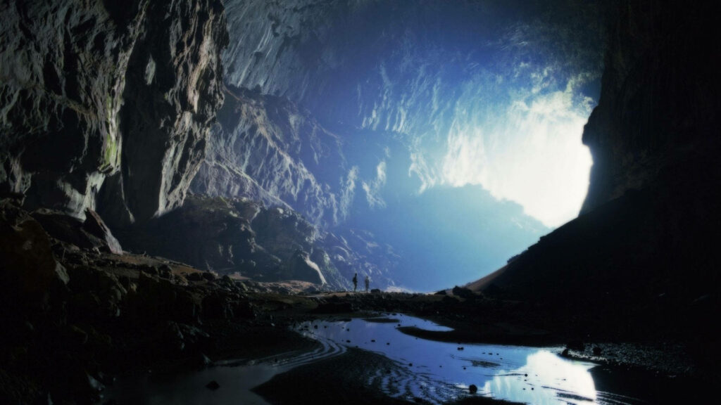 “Stunning Cave Interior with Reflective Pool – Nature's Grandeur Wallpaper”