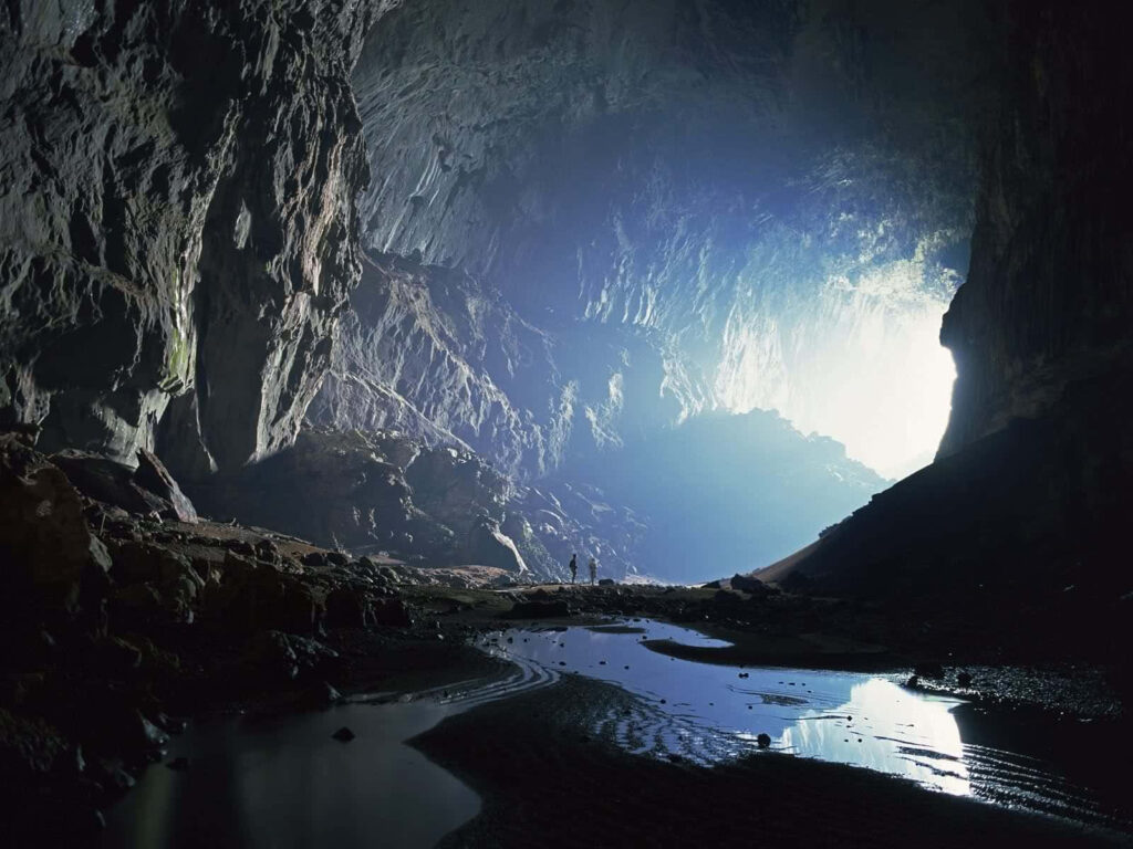 Enchanting Cave Illuminated by Sunlight: A Stunning Background Wallpaper