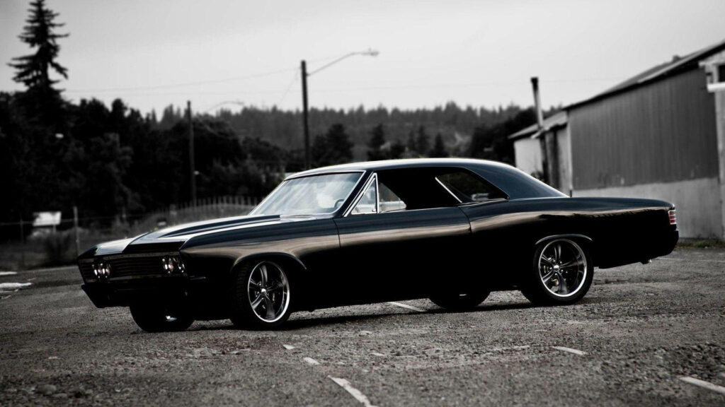 Chevrolet Chevelle Wallpaper: Bold Black Muscle Car in Rustic Setting