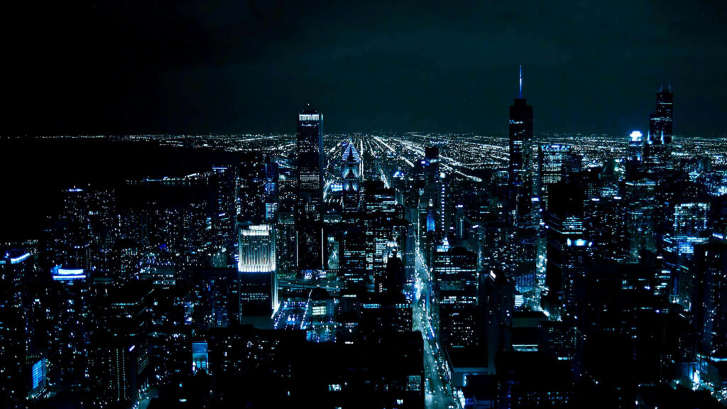 Stunning Chicago Night Skyline: Blue Lights & Cloudy Sky Wallpaper