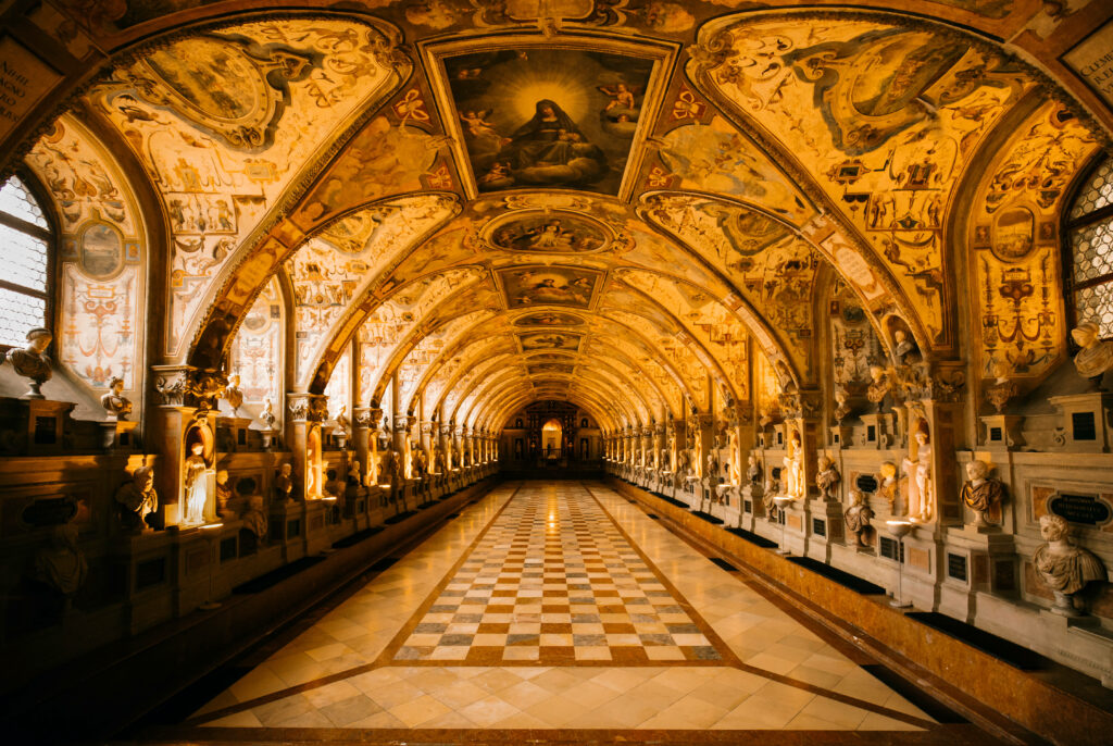 Stunning Historic Church Hallway Wallpaper: Golden Light & Ornate Details