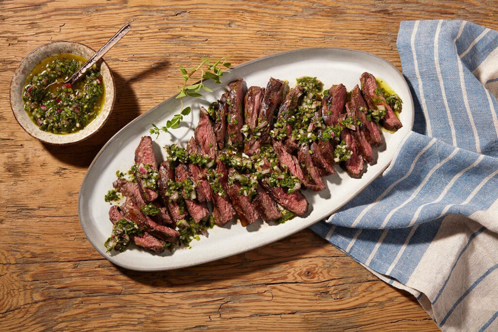Churrasco with Chimichurri on Rustic Table: Mouthwatering Wallpaper