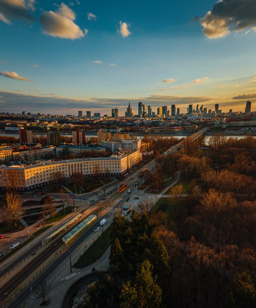 Stunning Aerial City Wallpaper: Sunset Over Trees & High-Rises