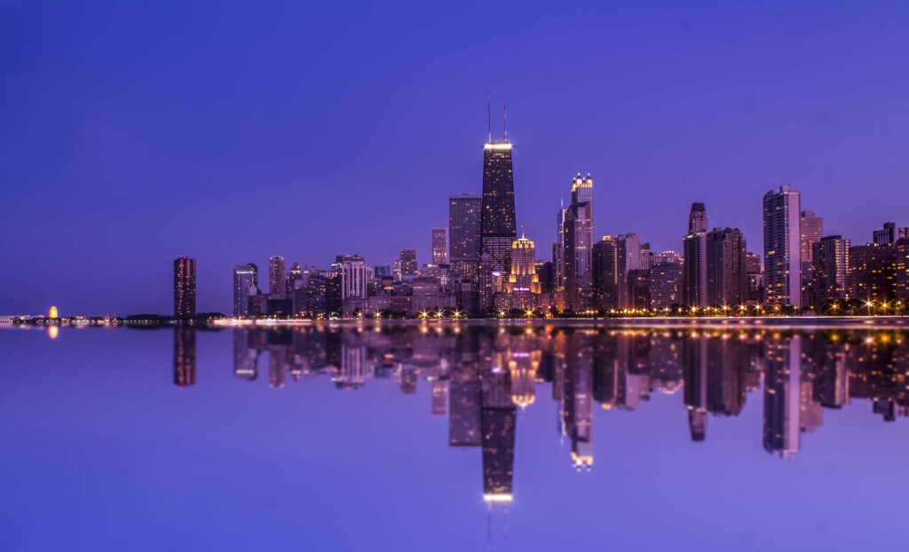 Stunning City Skyline Reflection at Night - Serene Wallpaper Background