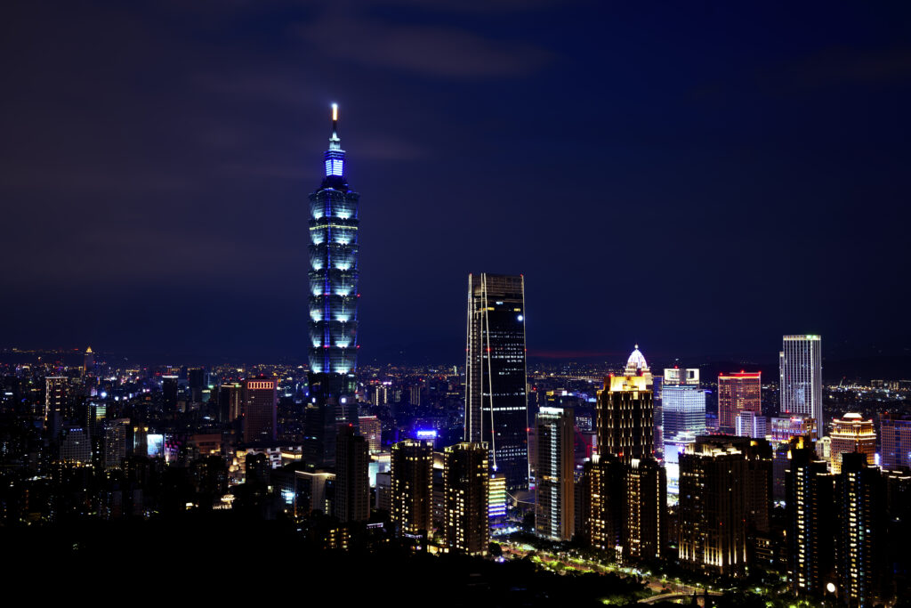 Vibrant Cityscape Night Wallpaper: Illuminated Urban Charm