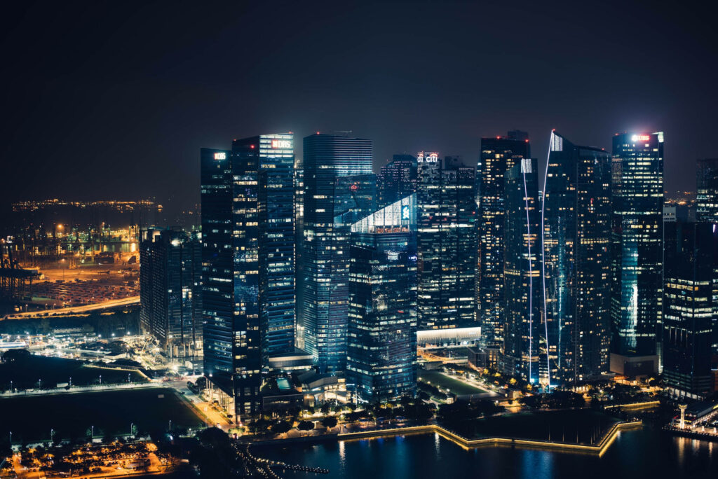 Breathtaking Night Cityscape Wallpaper with Serene River Reflection