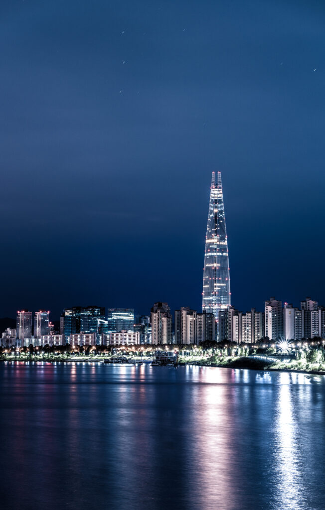 Stunning Night Cityscape Wallpaper: Skyscrapers & Reflective Water