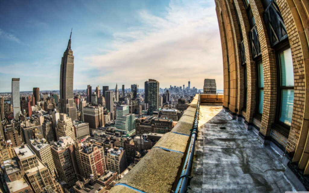 Stunning Rooftop Cityscape Wallpaper: Intricate Architecture & Skyline