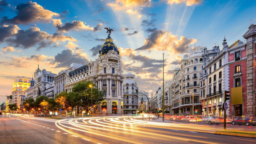 Vibrant Cityscape at Sunset: Stunning Architecture & Light Trails Wallpaper