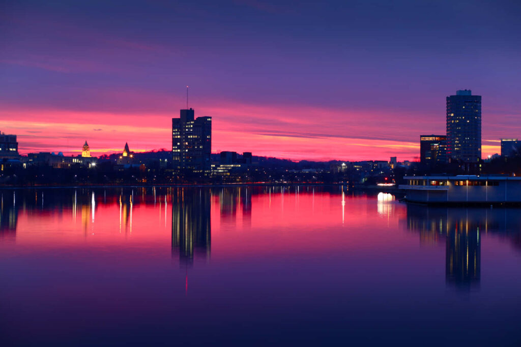 Stunning Sunset Cityscape Wallpaper: Vibrant Pink & Purple Reflection