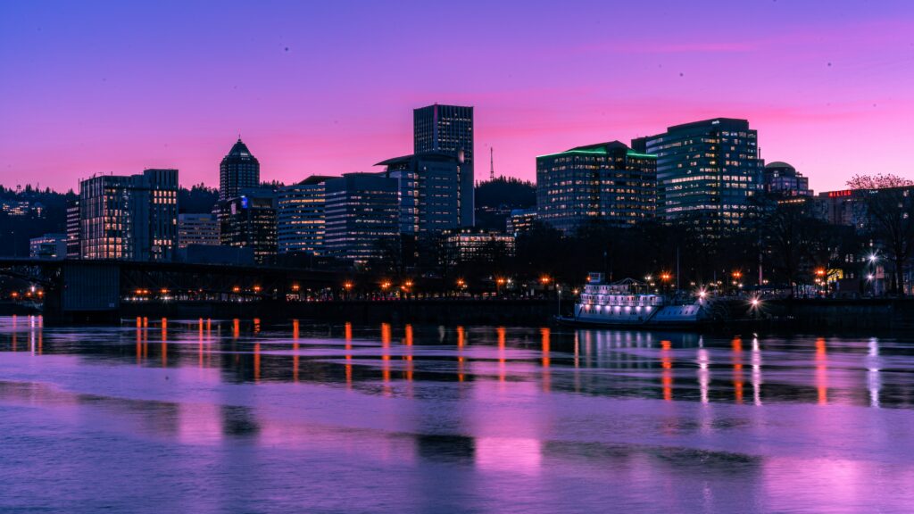 Stunning Sunset Cityscape Wallpaper: Serene River Reflection