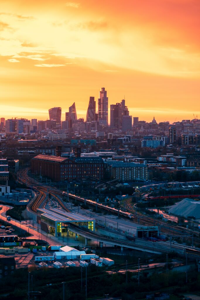 Stunning Cityscape Sunset Wallpaper: Modern Architecture & Vibrant Sky