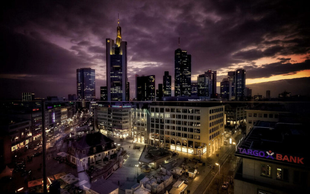 Stunning Cityscape Wallpaper: Bright Skyscrapers & Evening Sky
