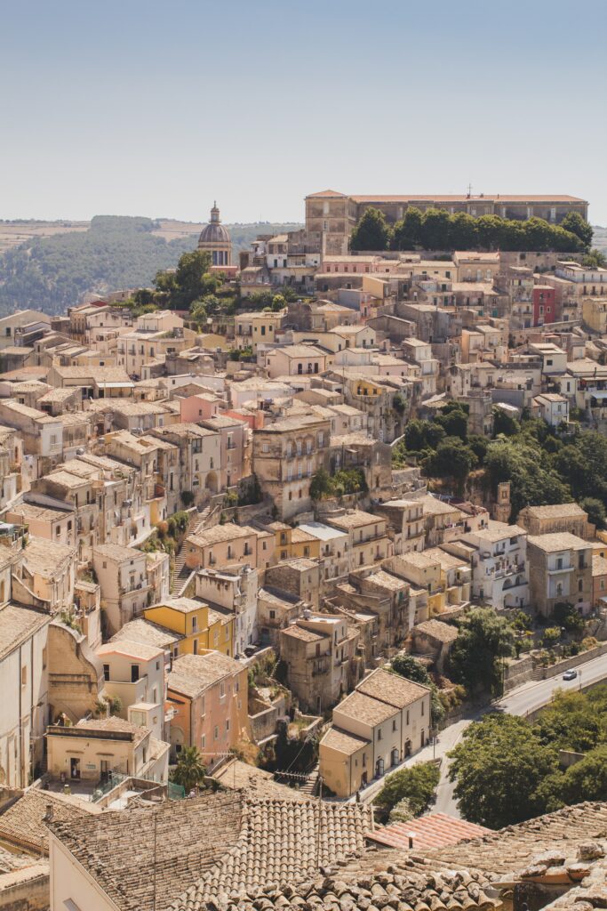 Charming Cityscape Wallpaper: Historic Buildings & Blue Sky Background