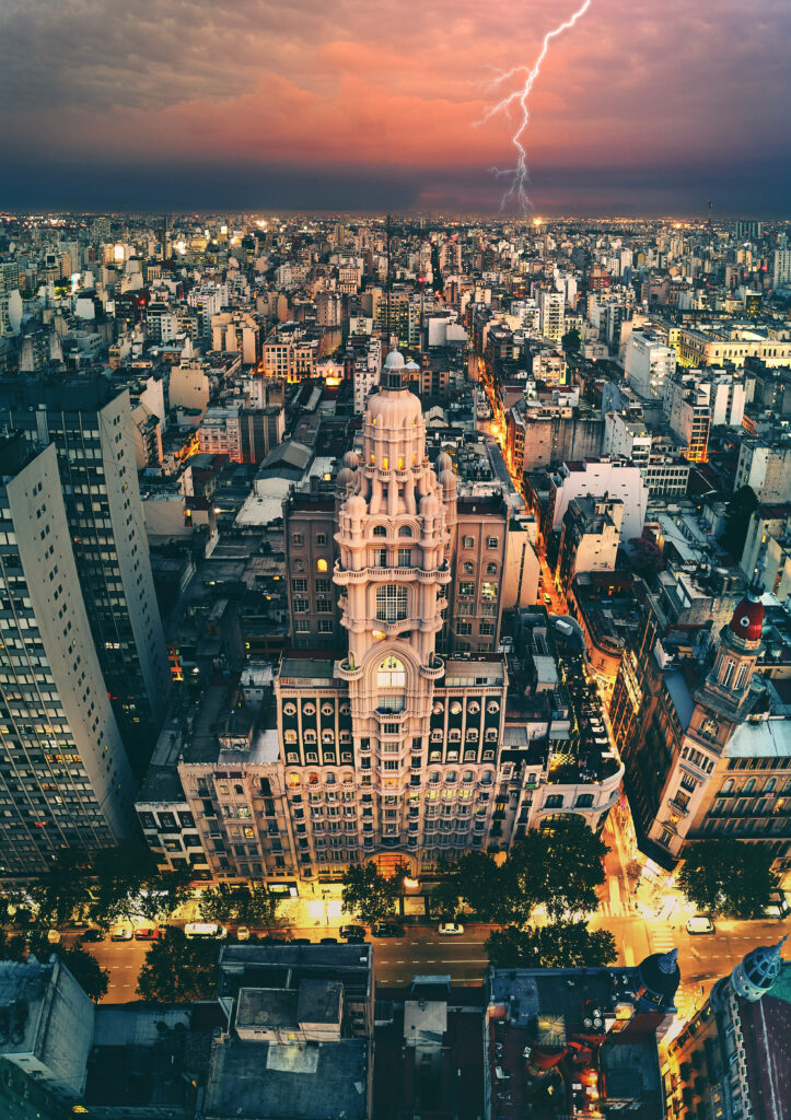 Stunning Cityscape Wallpaper: Vibrant Architecture & Lightning Sky