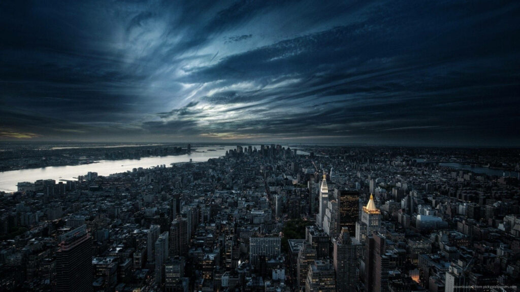 Stunning Cityscape Wallpaper: Metropolis Under Dramatic Clouds
