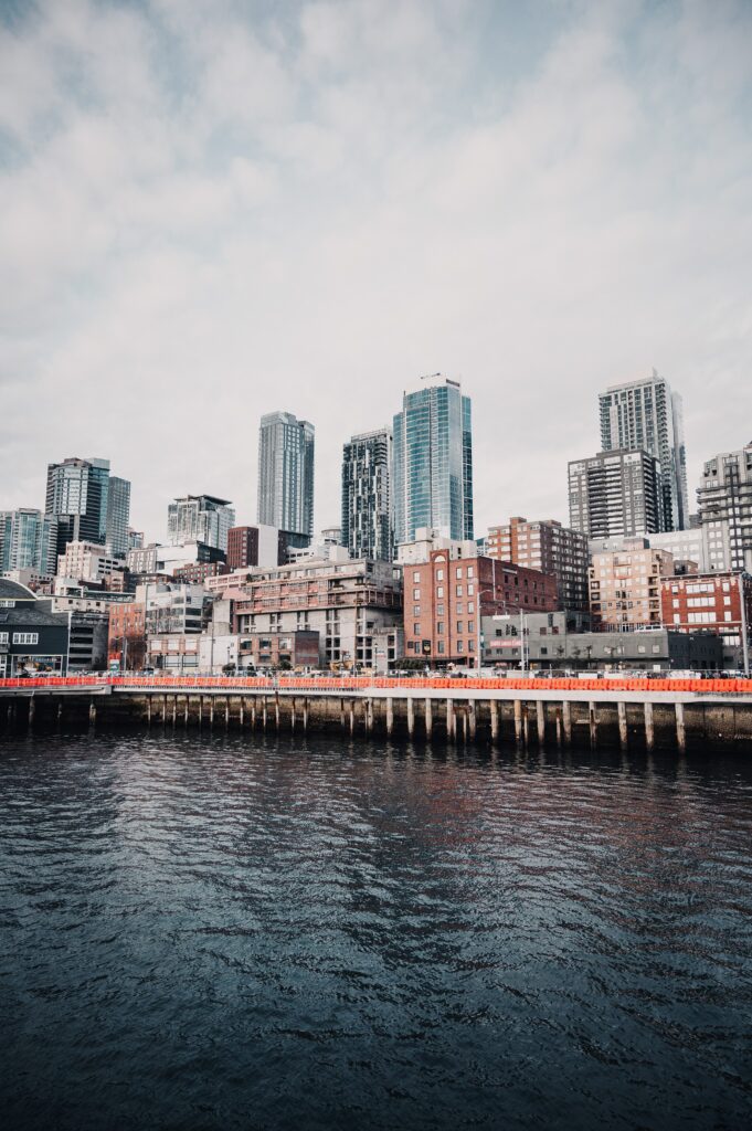 Stunning Cityscape Wallpaper: Modern Buildings & Tranquil Waterfront