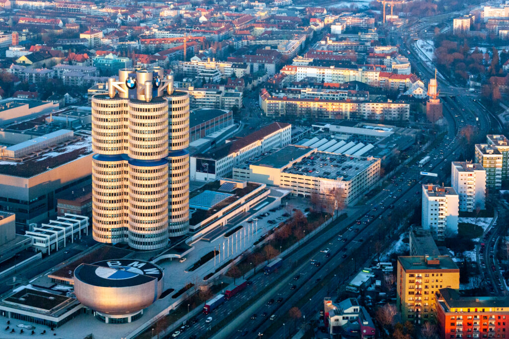 Stunning Cityscape Wallpaper Featuring BMW's Unique Cylindrical Design